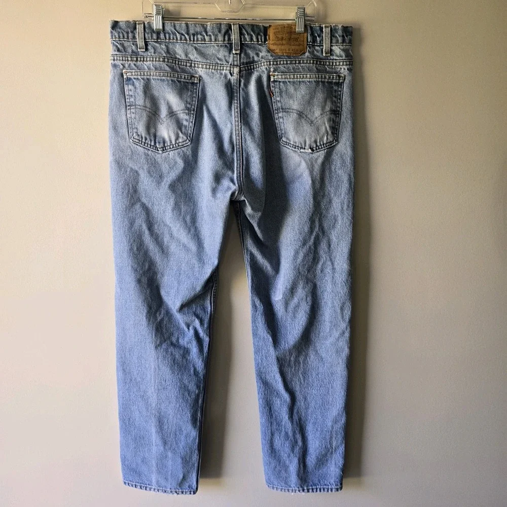 Vintage Levis 550 Relaxed Fit Tapered Leg Light Wash Orange Tab Jeans 40x32 Mens